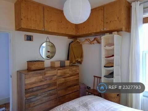 Main Bedroom With Cupboards And Clothes Rail