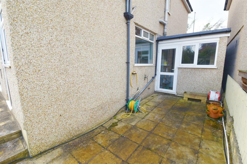 Patio to side and rear access to garage.jpg