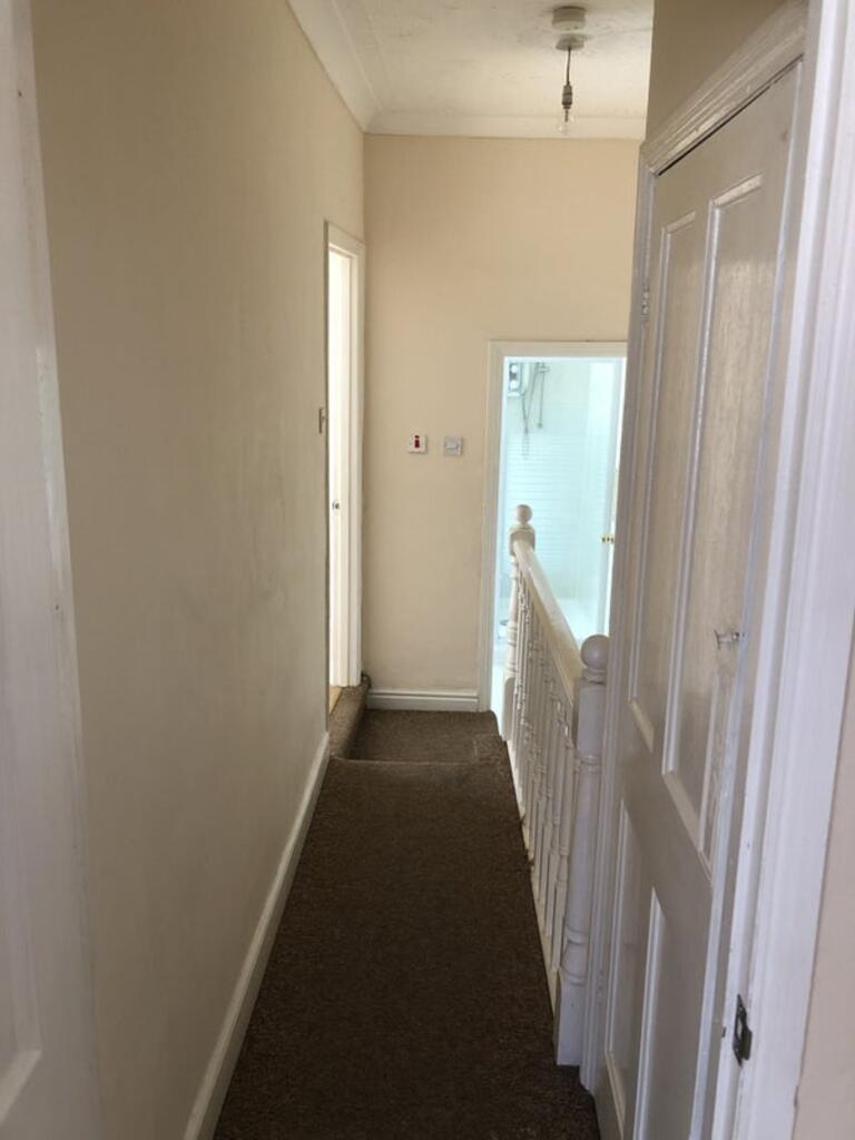 A tidy and well-maintained hallway with good li...