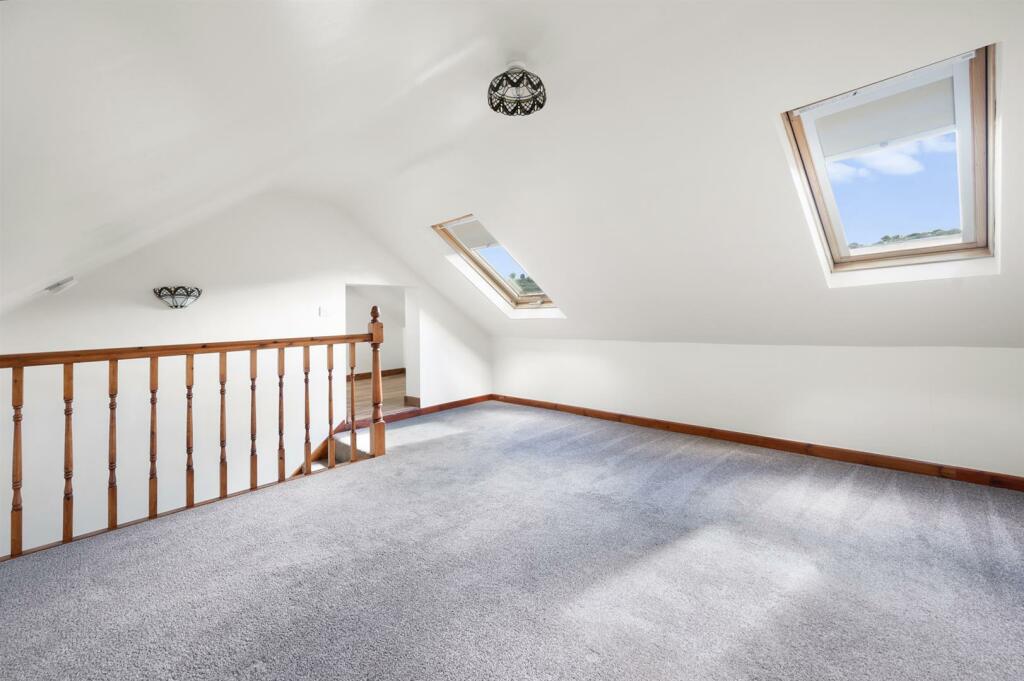 Bedroom Four to Velux windows.jpg