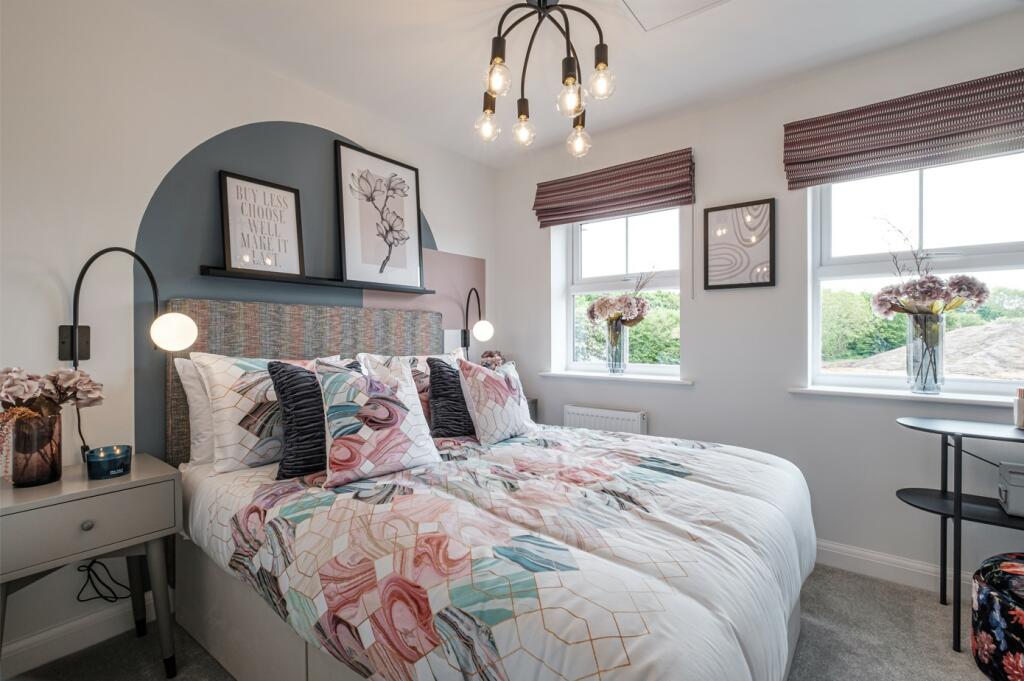 Double bedroom with painted blue arch behind the headboard