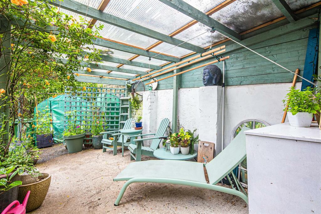 Covered seating area in garden