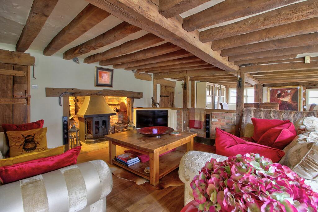 Living room with half-height wall to dining room