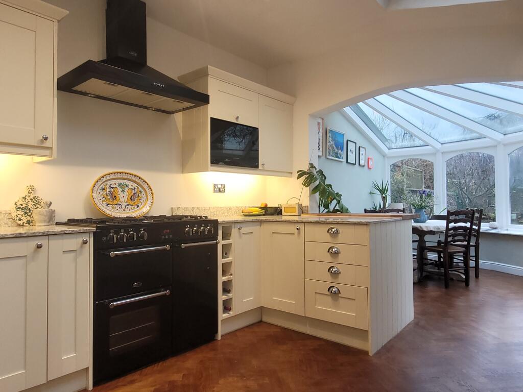 Kitchen through to dining conservatory