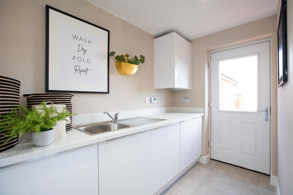 Handy utility room for the washing and extra outside access