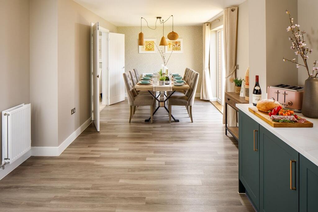 A kitchen dining room with space for the largest table