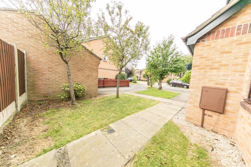 Front garden, garage and parking