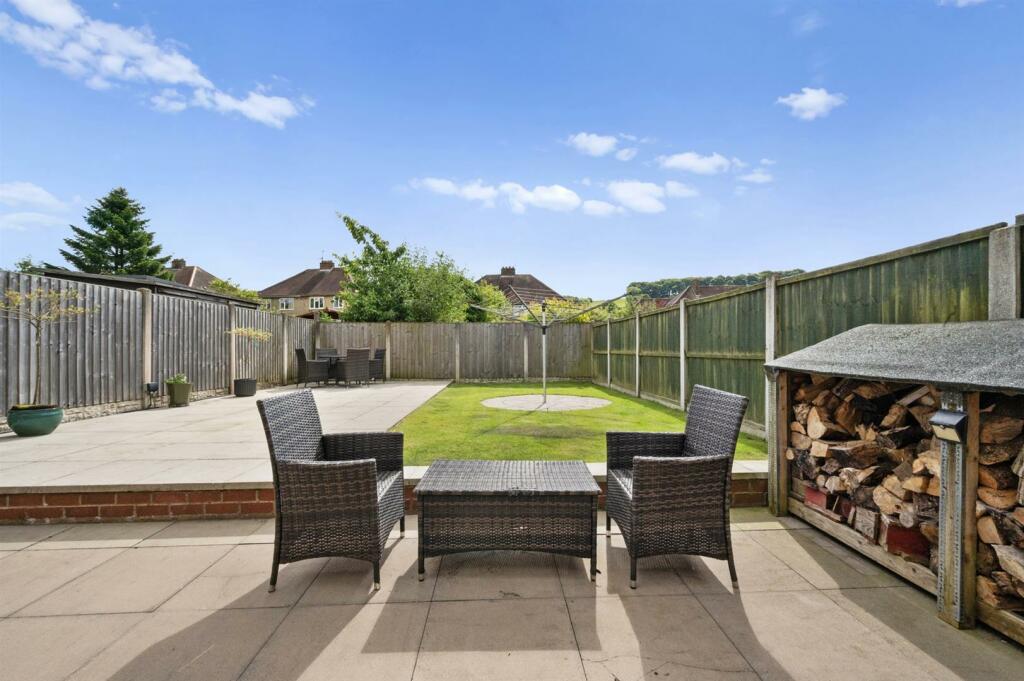 Rear Garden - dining patio and lawn.jpg