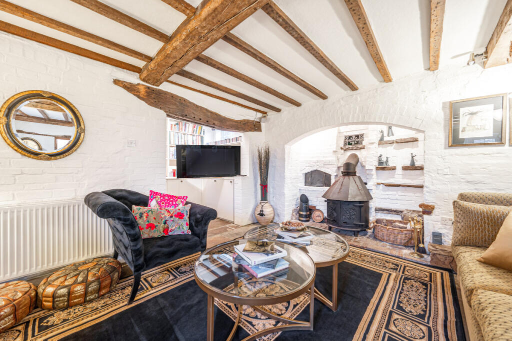 Sitting Room with inglenook fireplace and woodburner