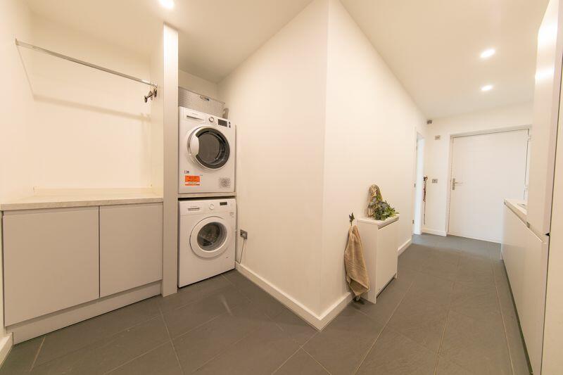 Utilities room, side porch and laundry