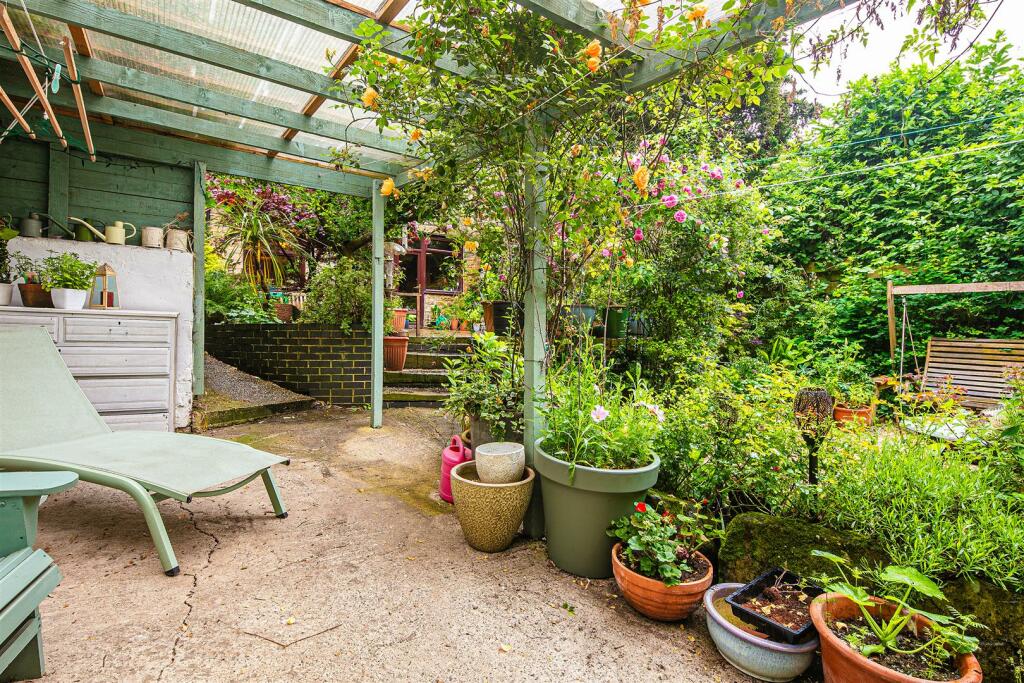 Covered seating area in garden