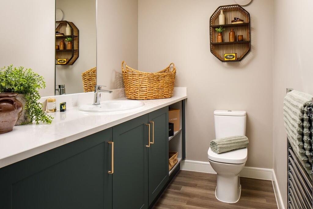 The ground floor cloakroom/utility room keeps the washing out of your kitchen