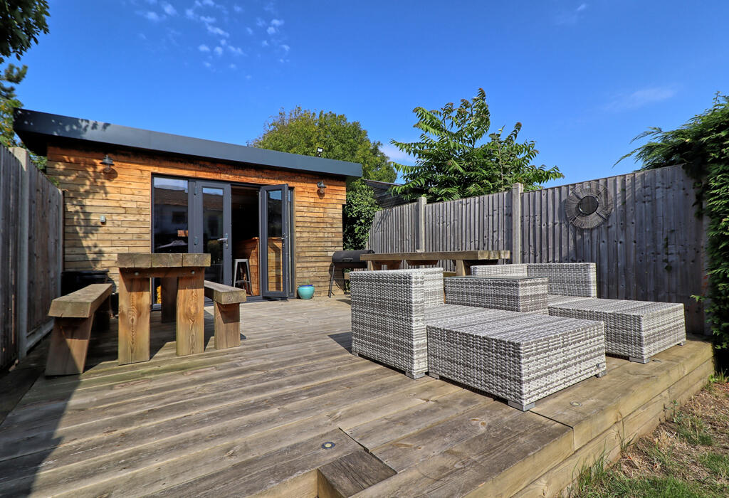 Decked patio to bar;/outbuilding