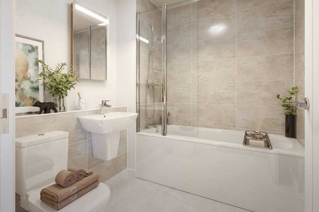 The relaxing family bathroom serves both bedrooms