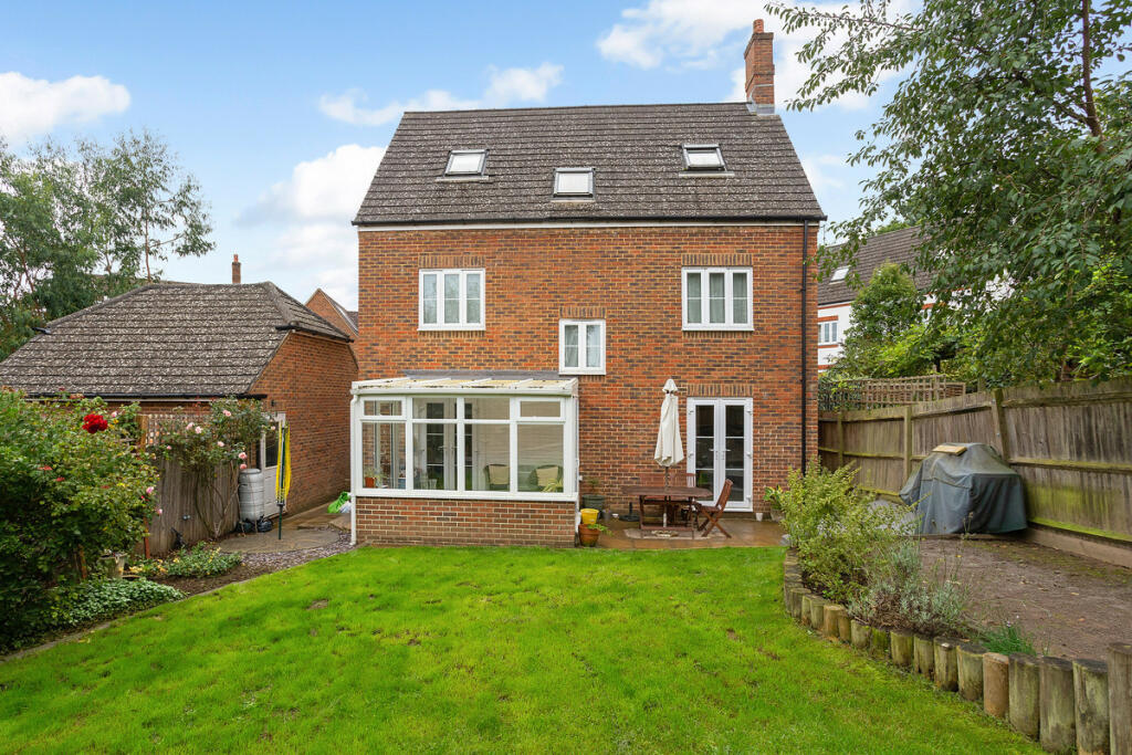 Rear garden, back of the house and detached double garage